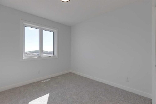 95 Southborough Crescent, Cochrane, AB - Indoor Photo Showing Other Room