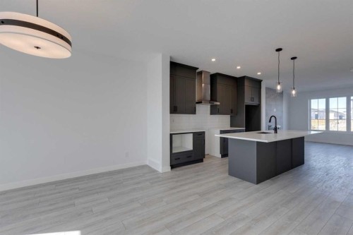 95 Southborough Crescent, Cochrane, AB - Indoor Photo Showing Kitchen With Upgraded Kitchen