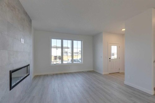 95 Southborough Crescent, Cochrane, AB - Indoor With Fireplace