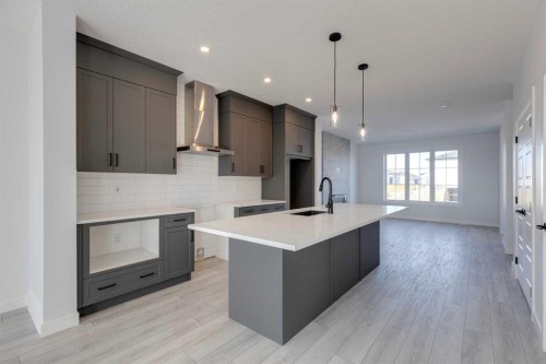 95 Southborough Crescent, Cochrane, AB - Indoor Photo Showing Kitchen With Upgraded Kitchen