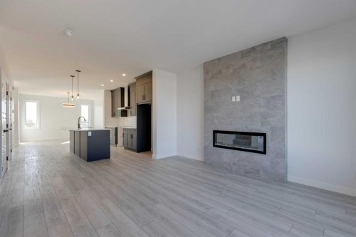 95 Southborough Crescent, Cochrane, AB - Indoor With Fireplace