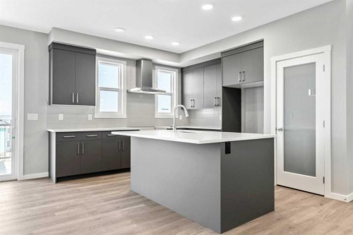 16 Heritage Link, Cochrane, AB - Indoor Photo Showing Kitchen With Upgraded Kitchen