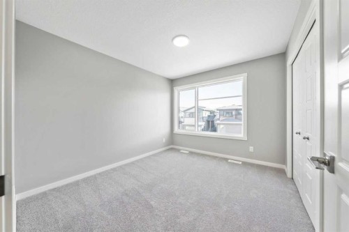 16 Heritage Link, Cochrane, AB - Indoor Photo Showing Other Room