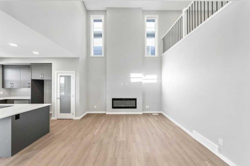 16 Heritage Link, Cochrane, AB - Indoor With Fireplace