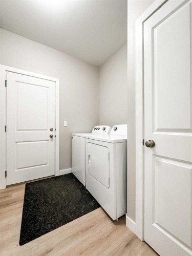 4438 Van Eaton Way, Clive, AB - Indoor Photo Showing Laundry Room