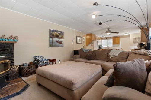 504 5Th Street, Norris Beach, AB - Indoor Photo Showing Living Room With Fireplace