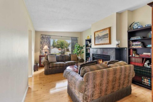 3948 35A Avenue, Red Deer, AB - Indoor Photo Showing Living Room With Fireplace