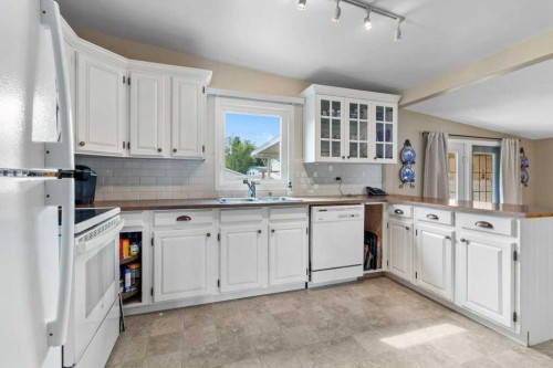3948 35A Avenue, Red Deer, AB - Indoor Photo Showing Kitchen With Double Sink