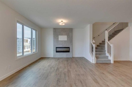 104 Amblefield Grove Nw, Calgary, AB - Indoor Photo Showing Living Room With Fireplace