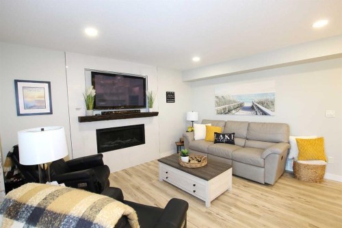 108 Marina Bay Court, Sylvan Lake, AB - Indoor Photo Showing Living Room With Fireplace