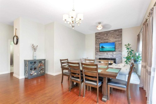 149 Carrington Drive, Red Deer, AB - Indoor Photo Showing Dining Room With Fireplace