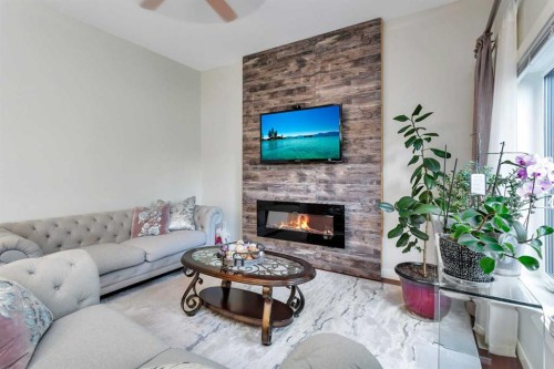 149 Carrington Drive, Red Deer, AB - Indoor Photo Showing Living Room With Fireplace