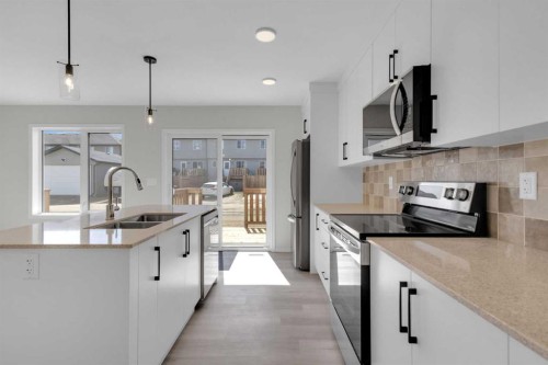 34 Anna Close, Blackfalds, AB - Indoor Photo Showing Kitchen With Double Sink With Upgraded Kitchen