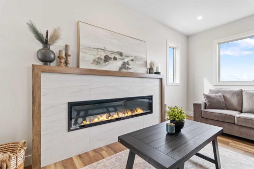 22 Aura Drive, Blackfalds, AB - Indoor Photo Showing Living Room With Fireplace