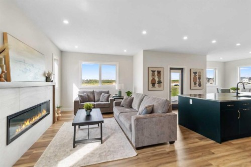 22 Aura Drive, Blackfalds, AB - Indoor Photo Showing Living Room With Fireplace