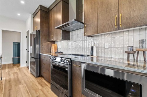 22 Aura Drive, Blackfalds, AB - Indoor Photo Showing Kitchen With Upgraded Kitchen