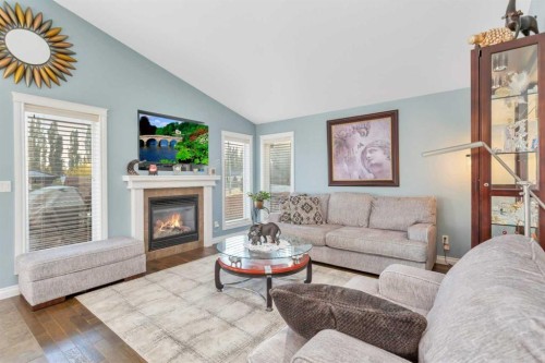 5 Heritage Drive, Penhold, AB - Indoor Photo Showing Living Room With Fireplace