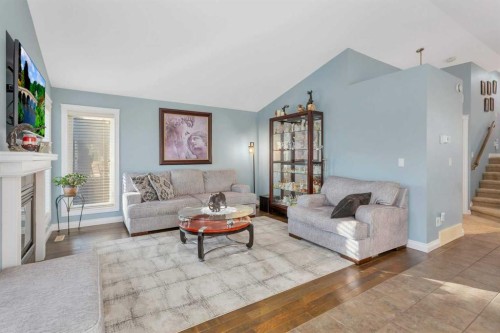 5 Heritage Drive, Penhold, AB - Indoor Photo Showing Living Room With Fireplace