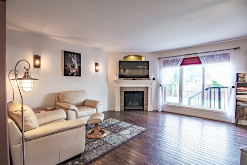 51 Illingworth Close, Red Deer, AB - Indoor Photo Showing Living Room With Fireplace