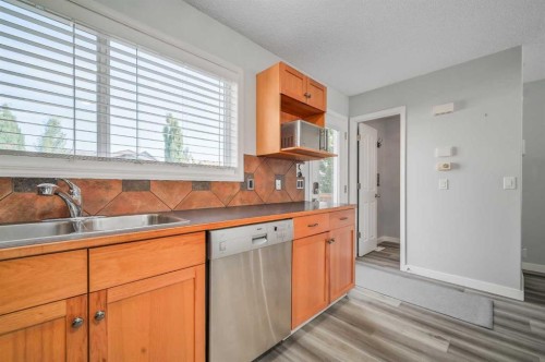 45 Cranberry Square, Calgary, AB - Indoor Photo Showing Kitchen With Double Sink