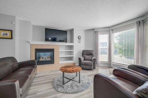 45 Cranberry Square, Calgary, AB - Indoor Photo Showing Living Room With Fireplace