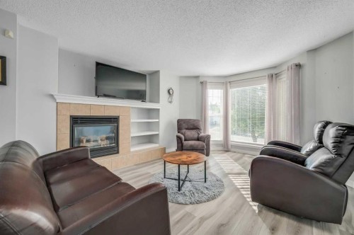 45 Cranberry Square, Calgary, AB - Indoor Photo Showing Living Room With Fireplace