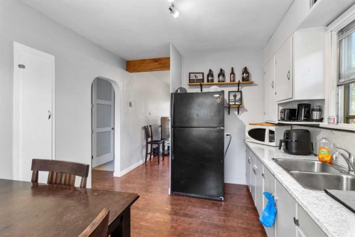 4732 52 Street, Sylvan Lake, AB - Indoor Photo Showing Kitchen With Double Sink