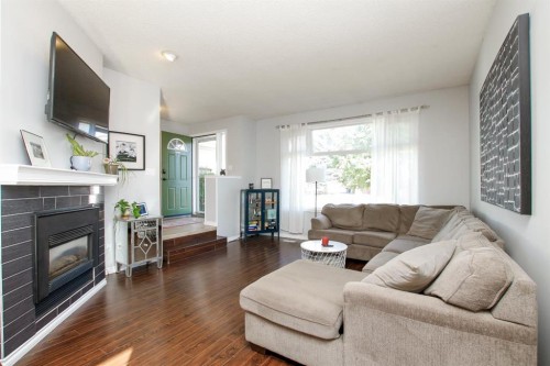 238 Davison Drive, Red Deer, AB - Indoor Photo Showing Living Room With Fireplace