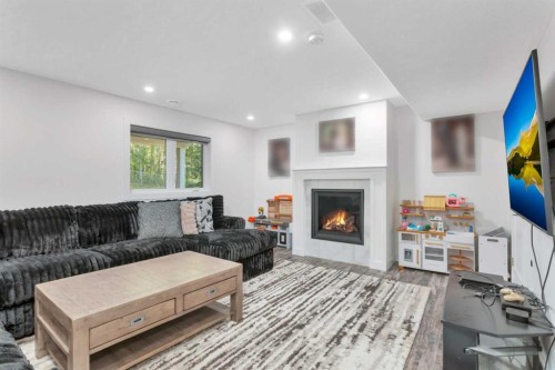 91-39200 Range Road 282, Rural Red Deer County, AB - Indoor Photo Showing Living Room With Fireplace