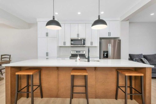 7 Evergreen Way, Red Deer, AB - Indoor Photo Showing Kitchen With Stainless Steel Kitchen With Upgraded Kitchen