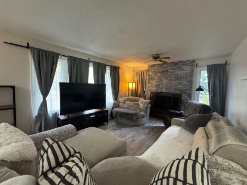 3807 62 Street, Camrose, AB - Indoor Photo Showing Living Room With Fireplace