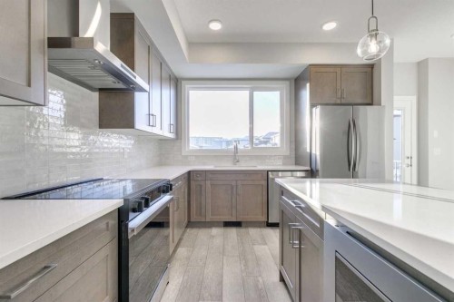 121 Silverton Glen Way Sw, Calgary, AB - Indoor Photo Showing Kitchen With Upgraded Kitchen