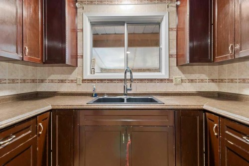 59 Nyman Crescent, Red Deer, AB - Indoor Photo Showing Kitchen With Double Sink