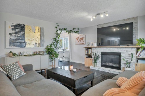 7715 73 Avenue Nw, Edmonton, AB - Indoor Photo Showing Living Room With Fireplace