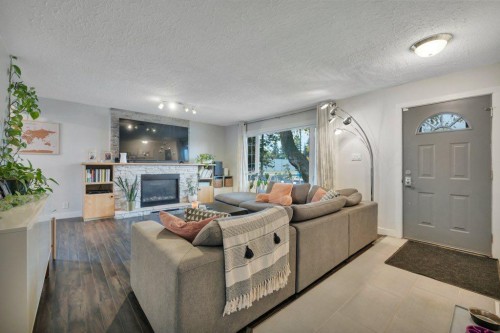 7715 73 Avenue Nw, Edmonton, AB - Indoor Photo Showing Living Room With Fireplace