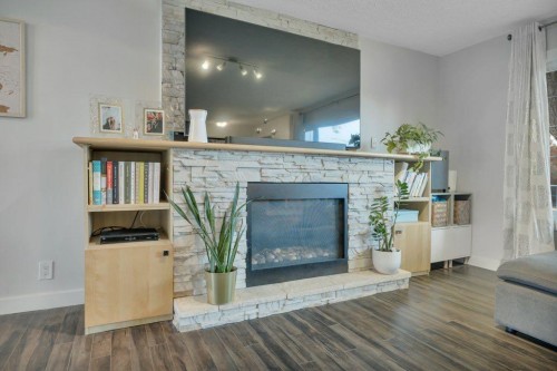 7715 73 Avenue Nw, Edmonton, AB - Indoor Photo Showing Living Room With Fireplace