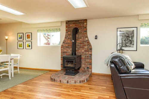 37 Wildrose Street, Rural Lacombe County, AB - Indoor Photo Showing Other Room With Fireplace