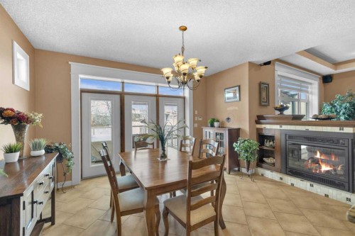 40 Oakfield Close, Red Deer, AB - Indoor Photo Showing Dining Room With Fireplace