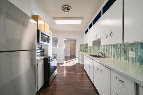 4828 53A Street, Camrose, AB - Indoor Photo Showing Kitchen With Double Sink