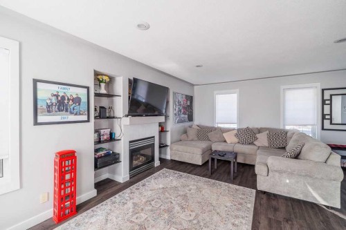 65 Fern Glade Crescent, Sylvan Lake, AB - Indoor Photo Showing Living Room With Fireplace