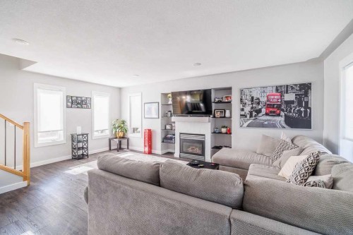 65 Fern Glade Crescent, Sylvan Lake, AB - Indoor Photo Showing Living Room With Fireplace