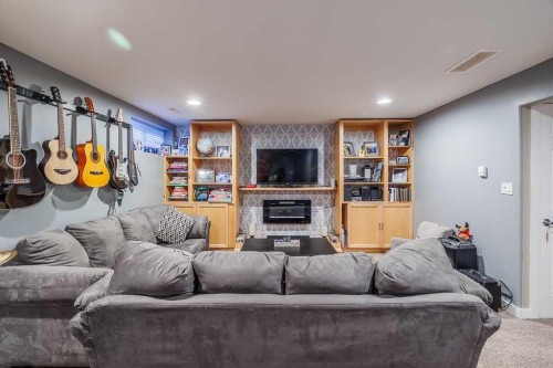 65 Fern Glade Crescent, Sylvan Lake, AB - Indoor With Fireplace