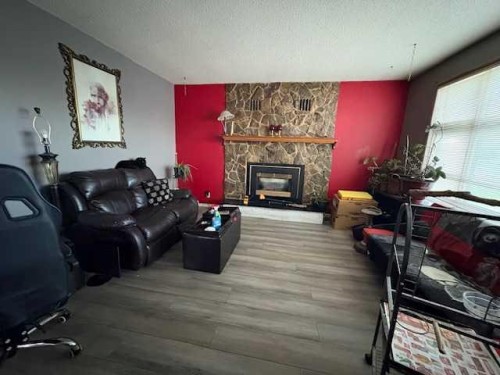 5232 55 Avenue, Eckville, AB - Indoor Photo Showing Living Room With Fireplace