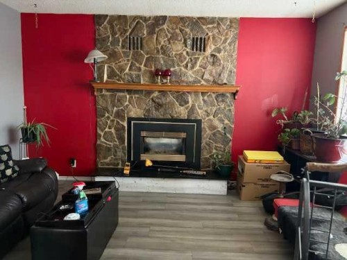 5232 55 Avenue, Eckville, AB - Indoor Photo Showing Living Room With Fireplace