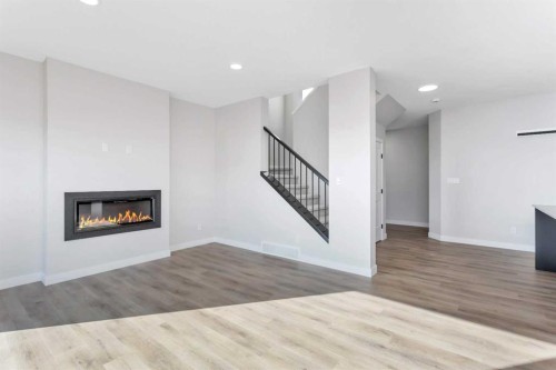 122 Norseman Close, Penhold, AB - Indoor Photo Showing Living Room With Fireplace