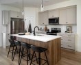 21 Emberside Park, Cochrane, AB  - Indoor Photo Showing Kitchen With Upgraded Kitchen 