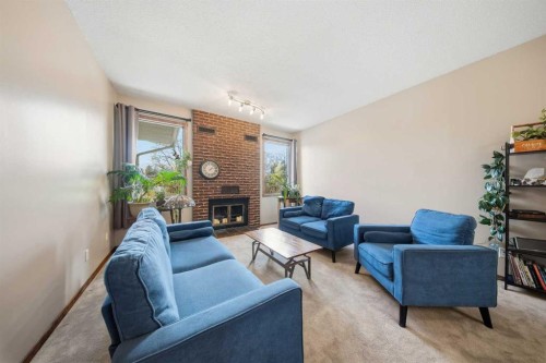 55 Nyman Crescent, Red Deer, AB - Indoor Photo Showing Living Room With Fireplace