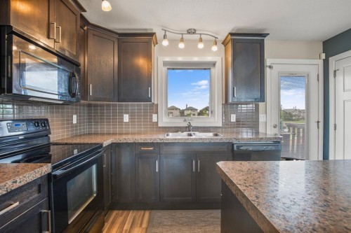 130 Larsen Crescent, Red Deer, AB - Indoor Photo Showing Kitchen With Double Sink With Upgraded Kitchen