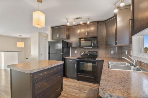130 Larsen Crescent, Red Deer, AB - Indoor Photo Showing Kitchen With Double Sink