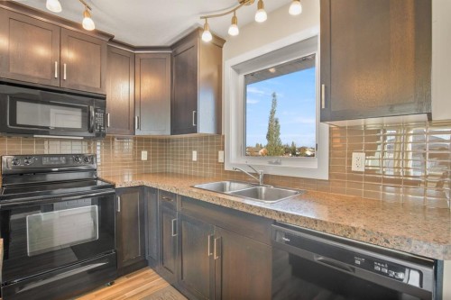 130 Larsen Crescent, Red Deer, AB - Indoor Photo Showing Kitchen With Double Sink